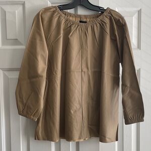 Faux leather blouse. NWT